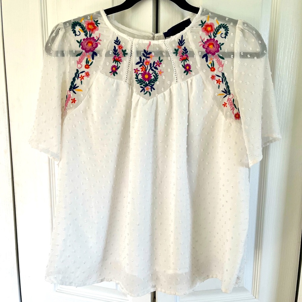White blouse with colorful embroidery